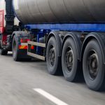 A fuel tanker drives down the highway